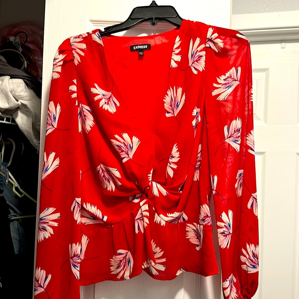 Flattering blouse from Express! Can be worn as a date night or work top